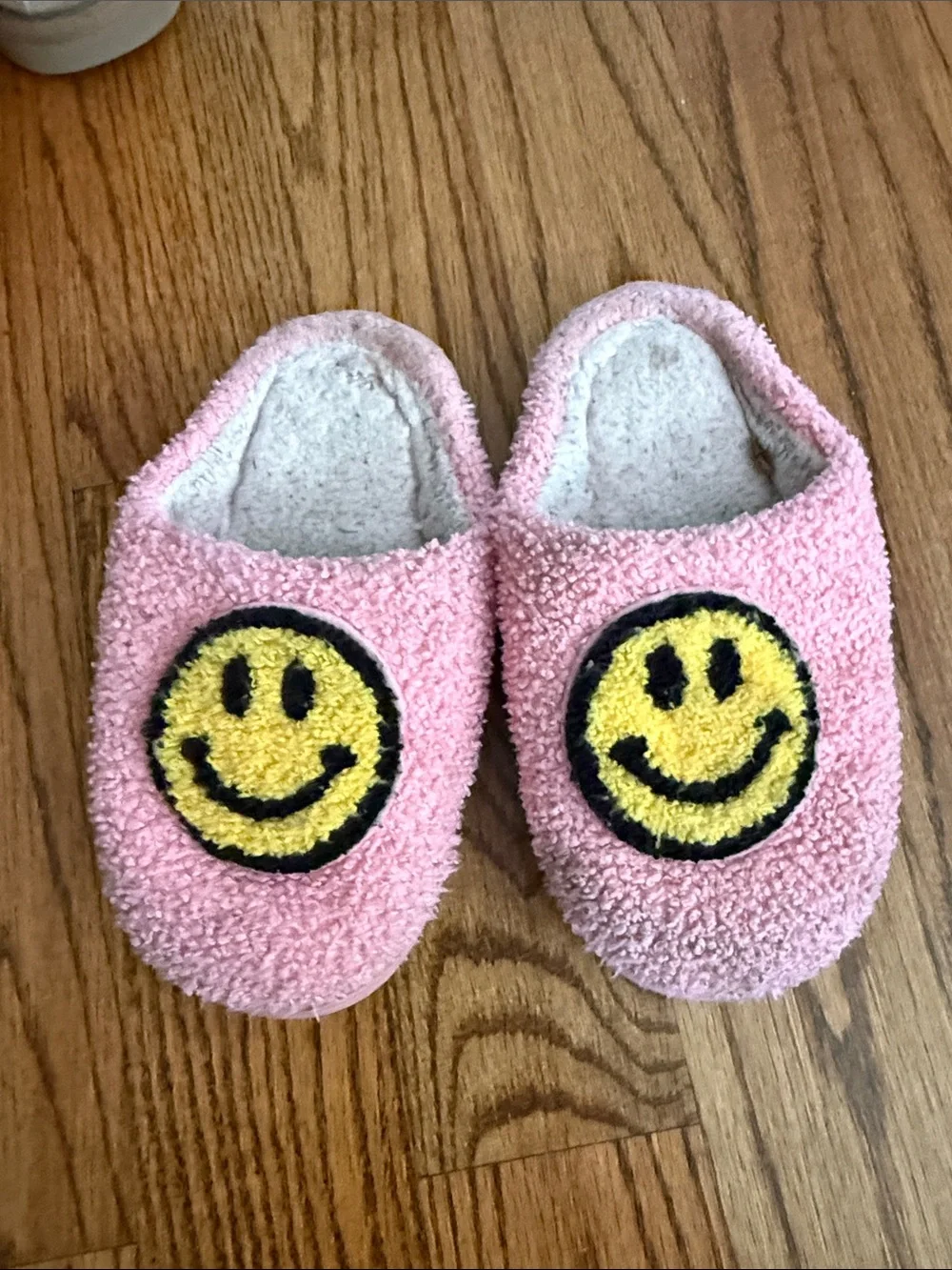 Pink Fuzzy Slip-On Slippers with Yellow Smiley Faces